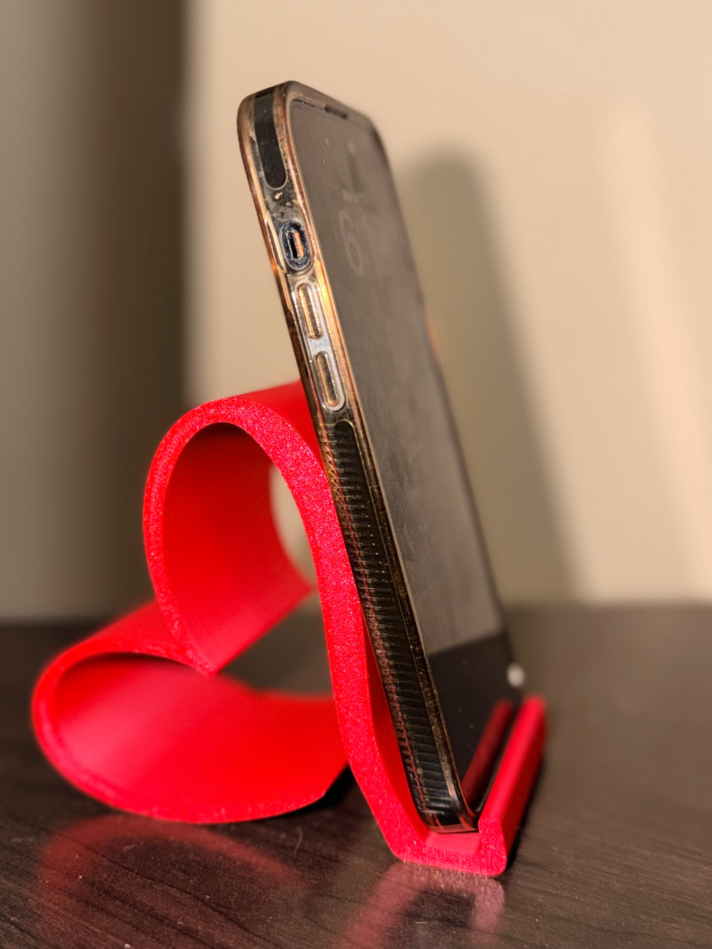 Heart phone stand, front view showing heart silhouette design