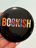 Bookish Soul 2.25 inch pinback button with multicolor letters on a black background