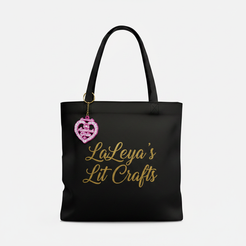 Audiobook Girlie pink keychain attached to a LaKeya's Lit Crafts tote bag
